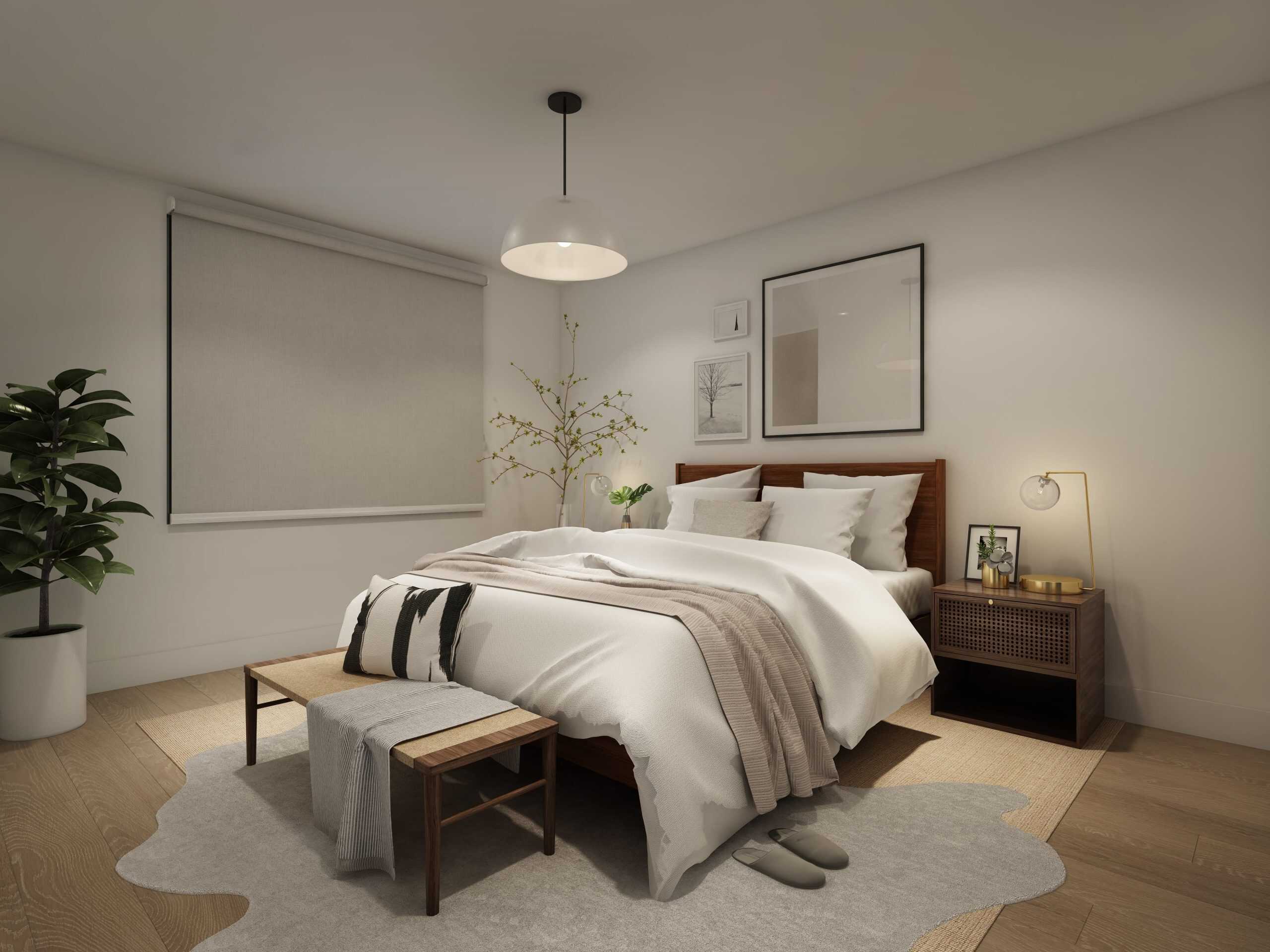 Modern bedroom with a neatly made bed, wooden bench, nightstand, lamp, framed art, potted plant, and soft lighting. A window with a closed shade is on the left wall.